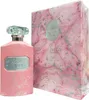 A pink perfume bottle and its matching box are displayed against a white background. Podgląd zdjęcia produktu