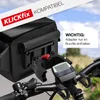 A close-up view of a black bicycle handlebar bag attached to a bicycle's handlebars, with a digital display visible. Podgląd zdjęcia produktu