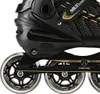 A close-up view of the side of a black and gold inline skate, showing the wheels, frame, and part of the boot. Podgląd zdjęcia produktu