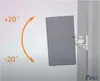 A gray speaker mounted on a white wall bracket, showing its adjustable angle. Produktbild-Vorschau