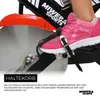 Close-up of a person's foot on a stationary bike pedal with straps. Produktbild-Vorschau