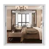 A bedroom interior with a bed, sofa, and window. Produktbild-Vorschau