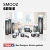A collection of tesa SMOOZ series bathroom accessories displayed in a bathroom setting. Náhled obrázku produktu