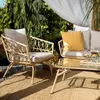 A patio furniture set on a deck with trees and a canopy in the background. Náhľad obrázku produktu