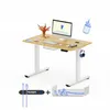 A white background with a light wood standing desk, computer, and accessories. Produktbild-Vorschau