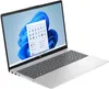 A silver HP laptop is shown from a diagonal angle, open and displaying the Windows 11 start menu on its screen. Produktbild-Vorschau