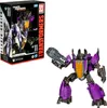 A Transformers Studio Series Skywarp action figure is shown next to its packaging. Podgląd zdjęcia produktu