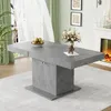 A dining room with a gray extendable table, a fireplace, and curtains. Podgląd zdjęcia produktu