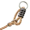 A close-up view of a rope swing attachment with metal rings and a plastic connector. Náhled obrázku produktu