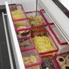 A drawer filled with clear plastic food storage containers holding various types of pasta, cookies, and other food items. Anteprima dell’immagine prodotto
