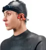 A swimmer wearing a swim cap, goggles, and a wetsuit, with waterproof headphones on. Náhľad obrázku produktu
