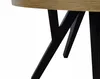 A close-up view of the legs and underside of a round table with a wooden top and black metal legs. Náhled obrázku produktu