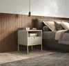 A bedroom scene with a nightstand next to a bed. Produktbild-Vorschau