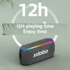 A portable Bluetooth speaker with LED lights and text indicating its playing time. Produktbild-Vorschau