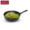 A frying pan with vegetables being cooked in it. Podgląd zdjęcia produktu