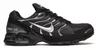 A side view of a black Nike Air Max Torch 4 sneaker against a white background. Voir les images du produit