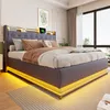 A bedroom with a bed, nightstand, and window. Voir les images du produit