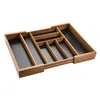 A bamboo cutlery organizer with black inserts, shown from a slightly elevated angle against a white background. Produktbild-Vorschau