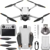 A flat lay of a DJI Mini 3 drone and its accessories, including a remote controller, extra propellers, a battery, and a charging cable. Náhľad obrázku produktu