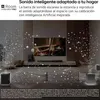 A living room with a TV and soundbar, with decorative particles floating around. Produktbild-Vorschau