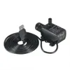 A black USB water pump with a coiled black cable is displayed on a white background. Náhľad obrázku produktu