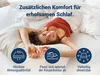 A woman is lying on a bed covered with white sheets, smiling at the camera. Three circular icons with text are displayed at the bottom of the image. Produktbild-Vorschau