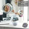 A disco ball diffuser sits on a vanity, with a person reflected in a makeup mirror in the background. Produktbild-Vorschau