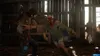 A person fighting a zombie inside a wooden structure. Produktbild-Vorschau