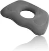 A gray orthopedic seat cushion with a hole in the center, shown on a white background with a reflection. Náhled obrázku produktu