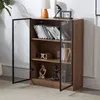 A wooden cabinet with glass doors displaying books and decorative items. Náhľad obrázku produktu