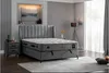 A bedroom scene featuring a bed, nightstand, and lamp. Produktbild-Vorschau