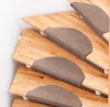 A close-up view of several wooden stairs with brown anti-slip treads. Voir les images du produit