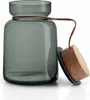 A glass storage jar with a wooden lid and leather strap. Voir les images du produit