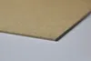 A close-up, angled view of a thin, rectangular MDF board on a plain background. Produktbild-Vorschau