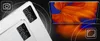 A marketing image showing the rear camera modules of two tablets and a close-up of a tablet screen displaying an abstract orange and blue image. Podgląd zdjęcia produktu