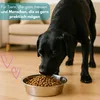 A black dog eating from a food bowl. Produktbild-Vorschau