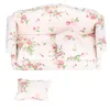 A miniature floral-patterned sofa and a separate cushion, presented against a white background. Náhled obrázku produktu