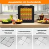 A kitchen counter with a food dehydrator and various accessories, along with fruit and drinks. Podgląd zdjęcia produktu