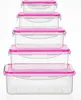 A stack of five clear plastic food storage containers with pink lids and latches, arranged vertically against a white background. Produktbild-Vorschau