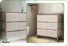 A bathroom storage unit with fabric drawers next to a toilet, and a separate view of the same unit in a different setting. Podgląd zdjęcia produktu