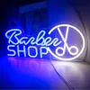A neon sign for a barber shop, with blue and white lights, displayed in a room. Podgląd zdjęcia produktu