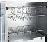 Interior view of a stainless steel smoker with racks and hooks. Náhled obrázku produktu