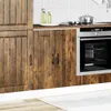 A kitchen scene showing wooden cabinets and a built-in oven. Náhľad obrázku produktu
