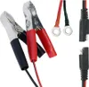 A close-up studio shot of various battery charging accessories against a white background. Produktbild-Vorschau