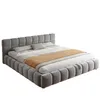 A gray upholstered bed with a headboard and frame, shown with bedding. Anteprima dell’immagine prodotto