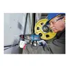 A man in a hard hat and safety glasses is using a Bosch rotary hammer drill on a concrete wall. Produktbild-Vorschau