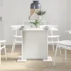 A white dining table with chairs in a bright, minimalist room. Anteprima dell’immagine prodotto