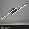 A modern black LED ceiling light with two angled light bars against a plain gray background. Produktbild-Vorschau