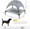 A diagram showing the dimensions of a dog bed with a canopy, along with a silhouette of a dog indicating how to measure its length. Produktbild-Vorschau