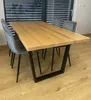 A dining table with four chairs in a room with blinds. Anteprima dell’immagine prodotto